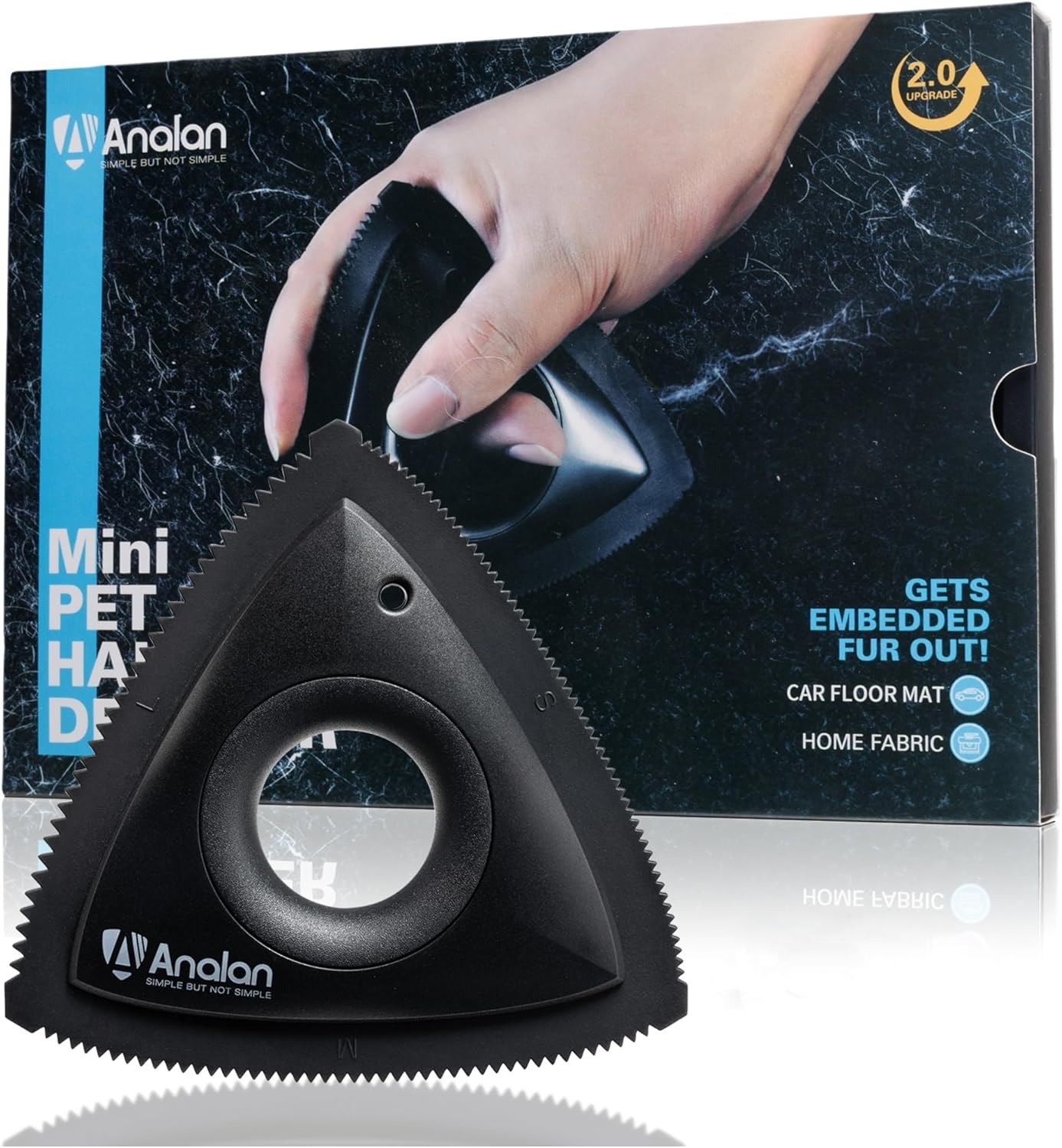 Black triangular pet hair remover, lint roller, and fabric shaver on a clean white background.