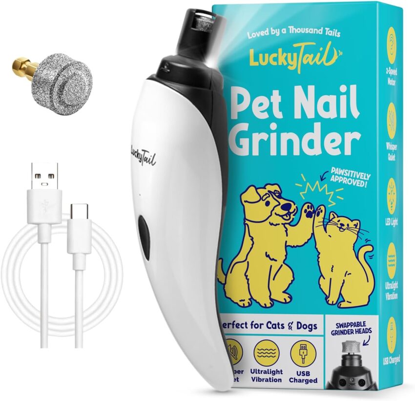 White and black pet nail grinder, replacement head, USB cable, colorful box, and cleaning brush on light gray.