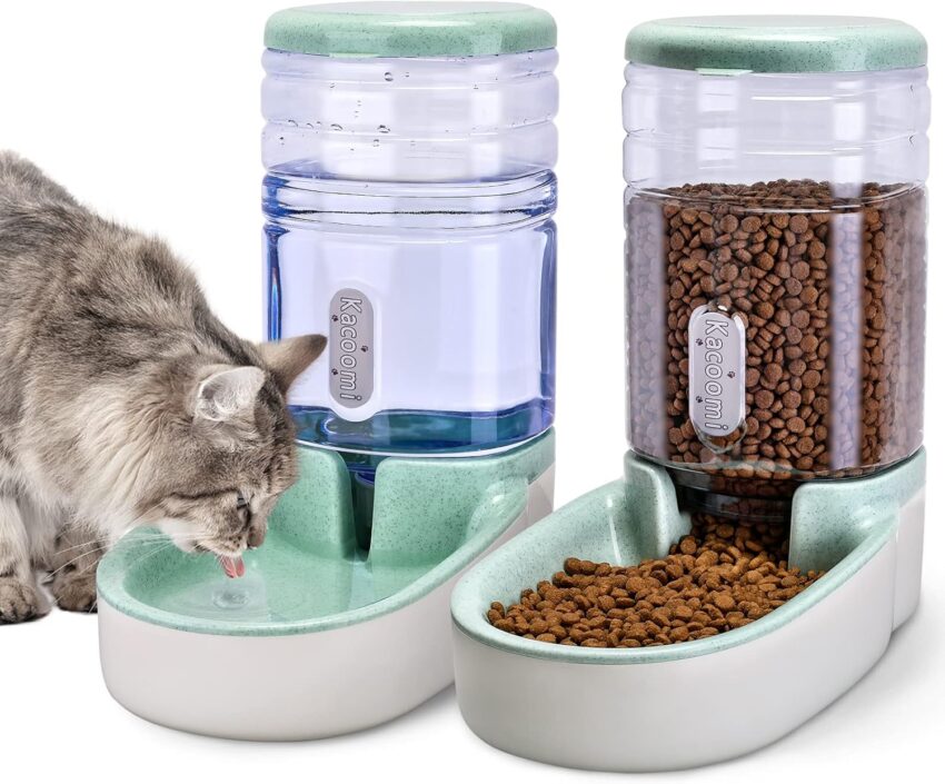 Fluffy grey cat drinks from a modern mint green and white gravity pet water dispenser, with a matching food feeder.