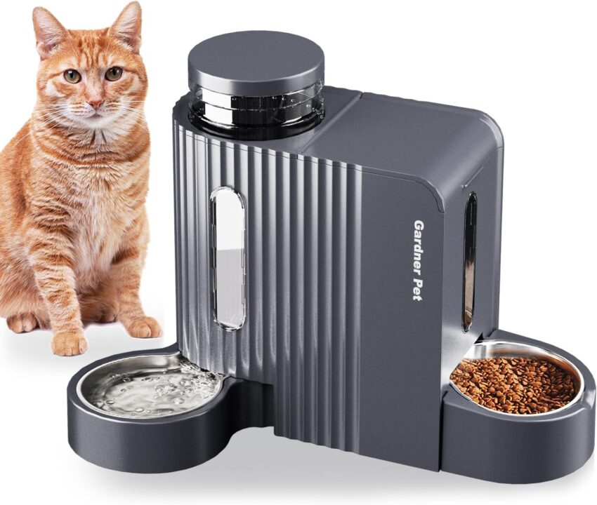 Modern dark gray automatic pet feeder with two steel bowls, flanked by matching water and food dispensers.