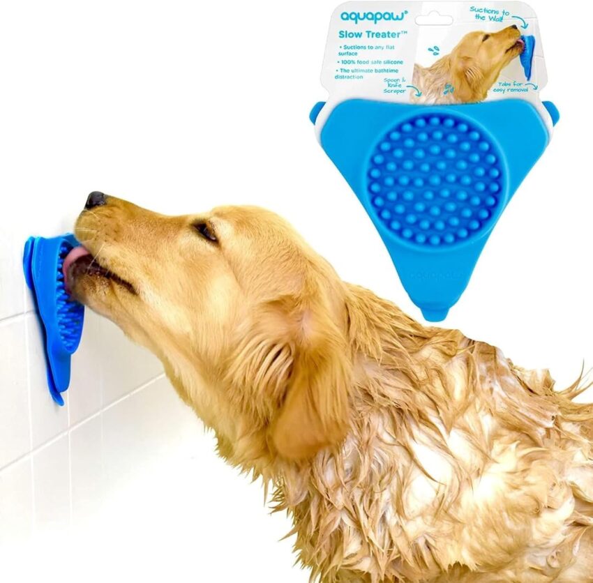 Three colorful silicone suction-cup slow feeder bowls for dogs on a light gray background.