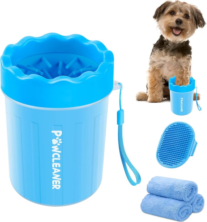 Blue pet grooming kit featuring paw cleaner, brush, two towels, and a small dog demonstrating cup use.