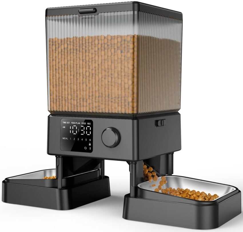 Sleek black automatic pet feeder dispensing kibble into a stainless steel bowl, with a digital display.